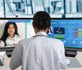 doctor looking at a patients information on a computer