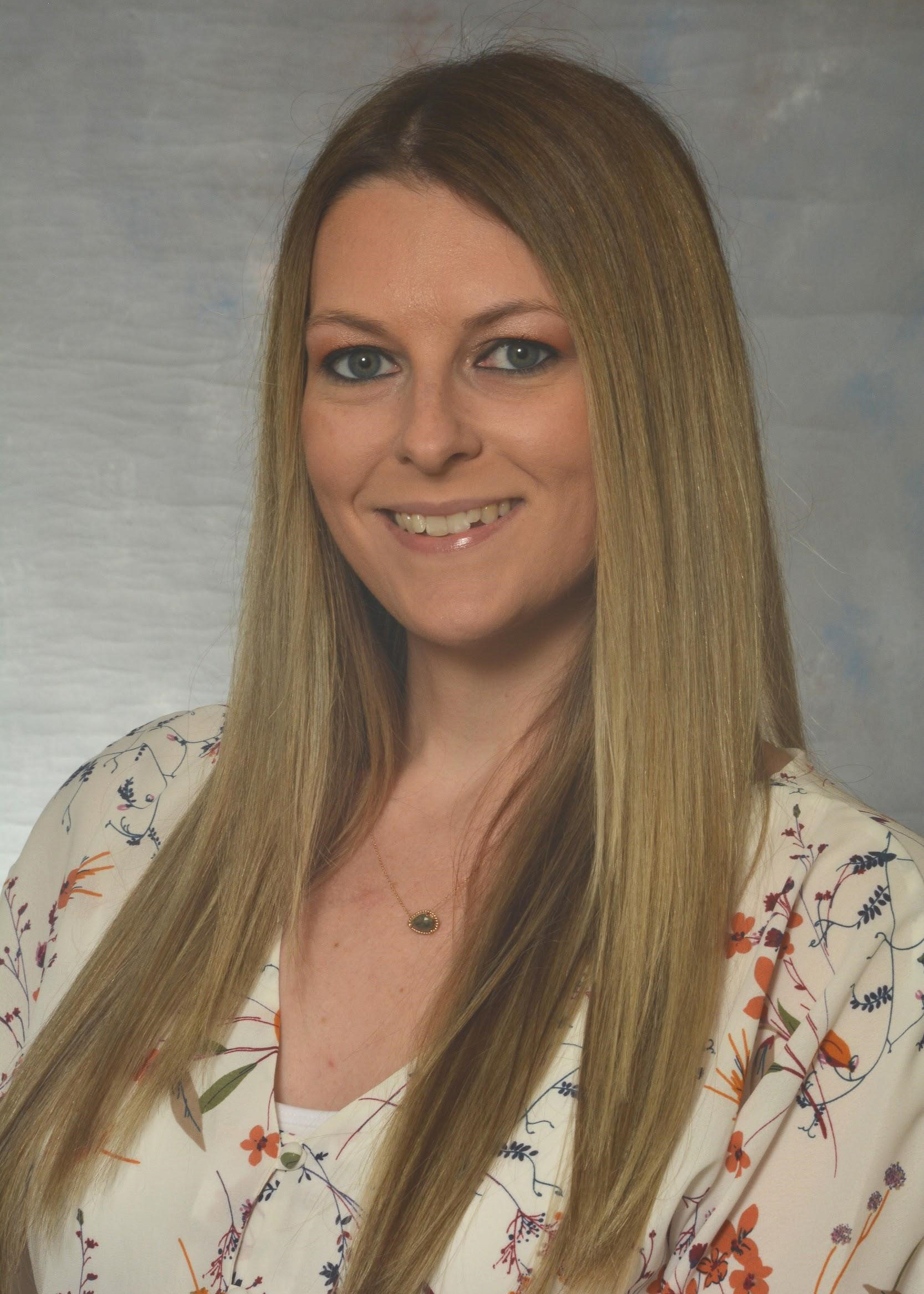 a headshot of Amie Musk, Academic Advisor